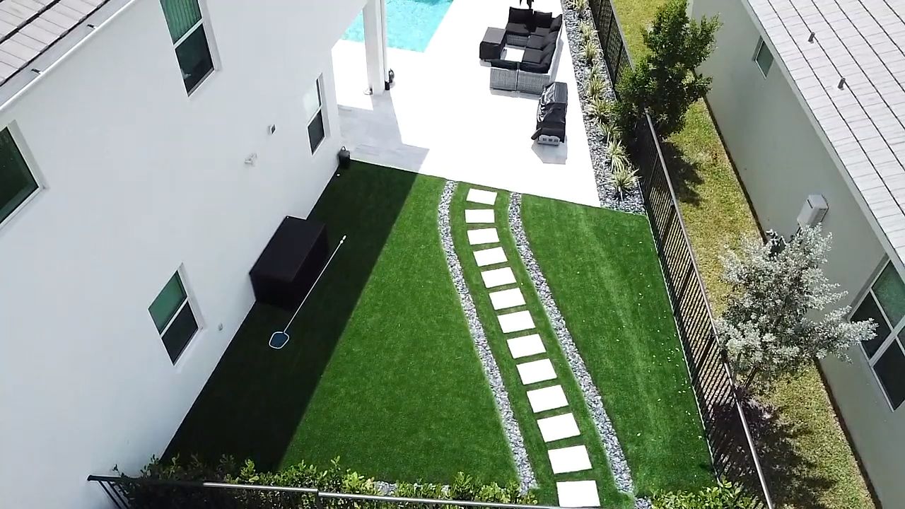 Side yard with stepping stones and turf